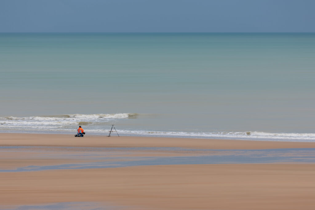 le pêcheur au bord de la plage